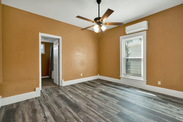 unfurnished room with ceiling fan, dark hardwood / wood-style floors, and a wall mounted air conditioner