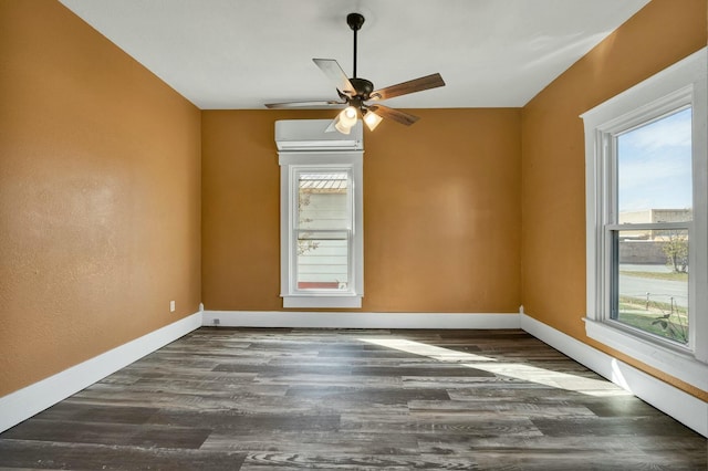 unfurnished room with dark hardwood / wood-style flooring, a wall mounted AC, and ceiling fan