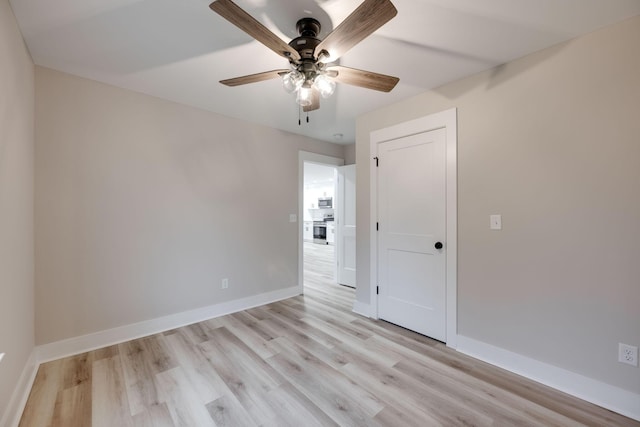 unfurnished room with light hardwood / wood-style flooring and ceiling fan