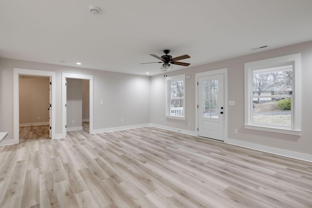 unfurnished living room with ceiling fan and light hardwood / wood-style flooring