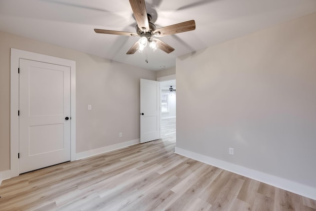 unfurnished room featuring ceiling fan and light hardwood / wood-style flooring