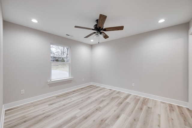 unfurnished room featuring light hardwood / wood-style floors and ceiling fan