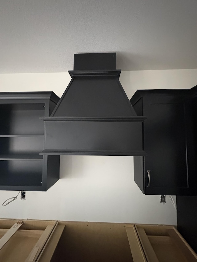 interior space with dark cabinetry