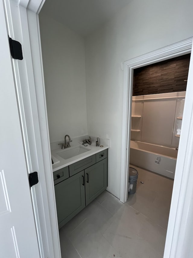 full bath with toilet, a bathing tub, tile patterned flooring, and vanity