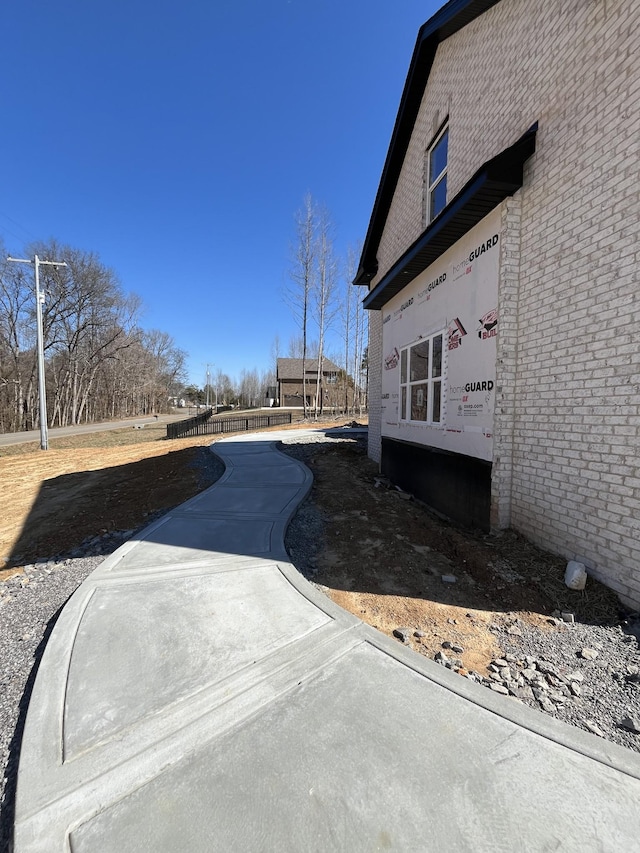 view of home's exterior with brick siding