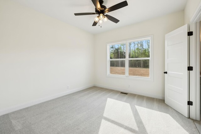 1049 Gholson Rd, Clarksville, TN 37043 - unfurnished room featuring baseboards, light carpet, visible vents, and a ceiling fan