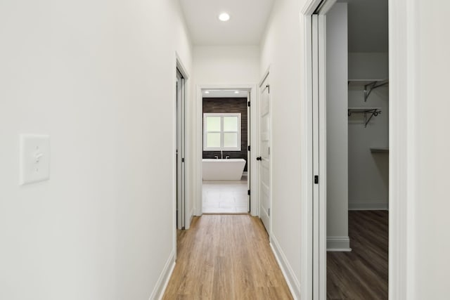 1049 Gholson Rd, Clarksville, TN 37043 - hall featuring recessed lighting, light wood-style flooring, and baseboards