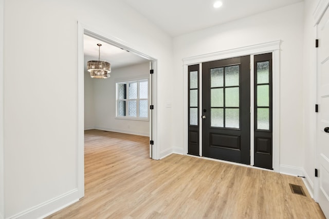 1049 Gholson Rd, Clarksville, TN 37043 - entrance foyer featuring recessed lighting, visible vents, baseboards, light wood-style flooring, and a notable chandelier
