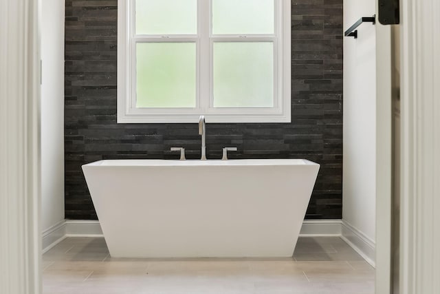 1049 Gholson Rd, Clarksville, TN 37043 - full bath featuring baseboards and a freestanding bath
