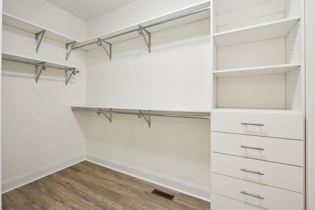1049 Gholson Rd, Clarksville, TN 37043 - spacious closet featuring wood finished floors and visible vents