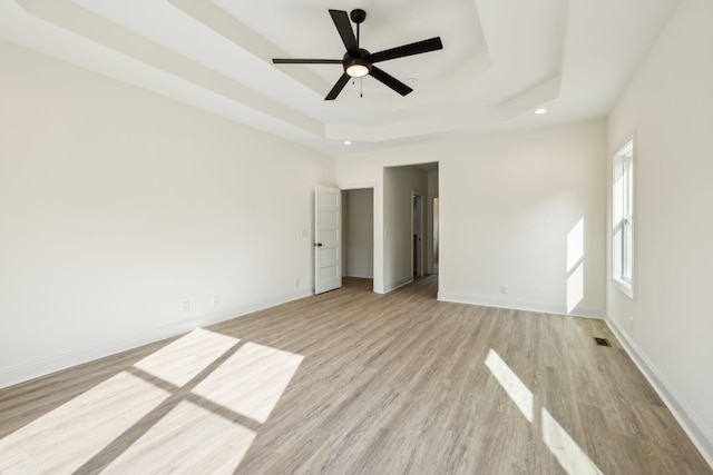 1049 Gholson Rd, Clarksville, TN 37043 - unfurnished bedroom featuring recessed lighting, baseboards, light wood-style floors, and a raised ceiling