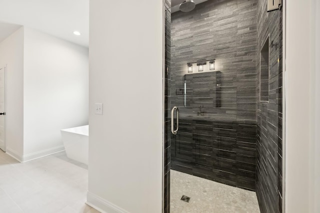 1049 Gholson Rd, Clarksville, TN 37043 - bathroom with baseboards, recessed lighting, a shower stall, and a freestanding bath