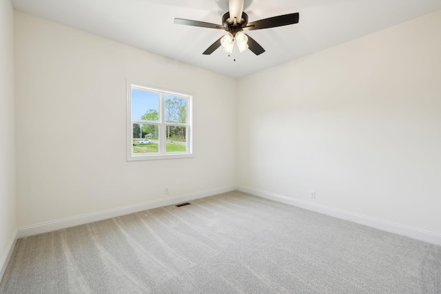 1049 Gholson Rd, Clarksville, TN 37043 - spare room with baseboards, visible vents, a ceiling fan, and light colored carpet