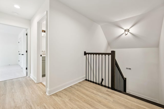 1049 Gholson Rd, Clarksville, TN 37043 - additional living space featuring baseboards, vaulted ceiling, visible vents, and light wood-style flooring