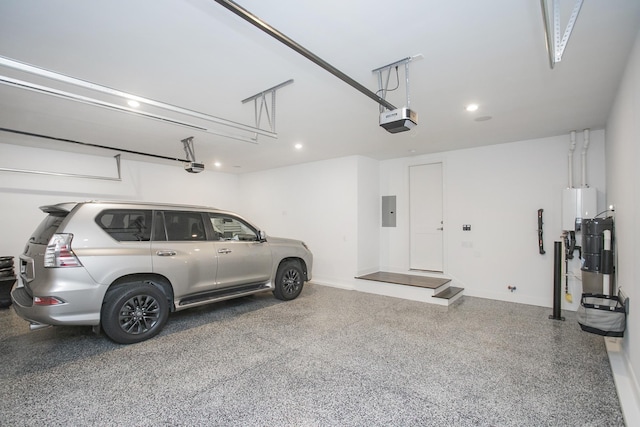 garage featuring recessed lighting, electric panel, baseboards, and a garage door opener