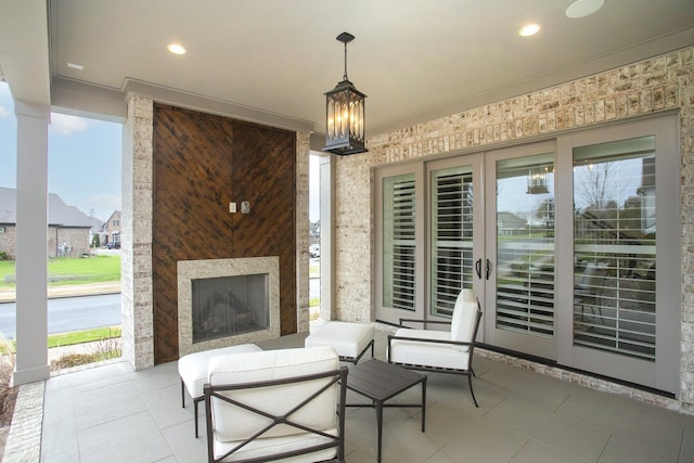 view of patio featuring a multi sided fireplace