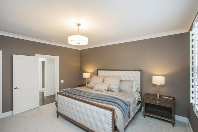 carpeted bedroom with baseboards and ornamental molding