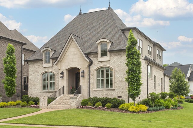 1141 Landing Pvt Ct, Gallatin, TN 37066 - french country home with a front lawn and roof with shingles