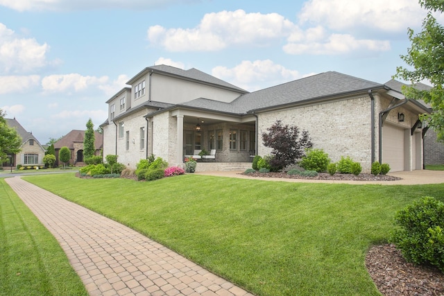 1141 Landing Pvt Ct, Gallatin, TN 37066 - view of front facade with brick siding, a front yard, driveway, and an attached garage
