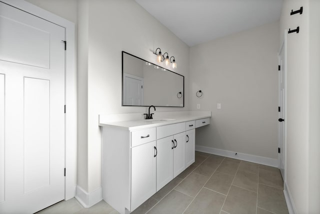 bathroom with tile patterned floors and vanity