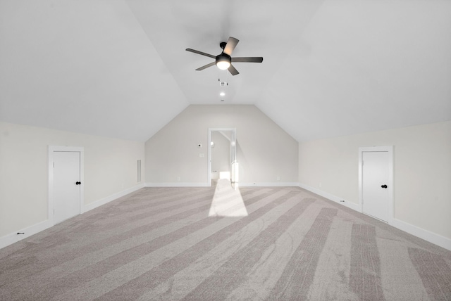 bonus room with light carpet, vaulted ceiling, and ceiling fan