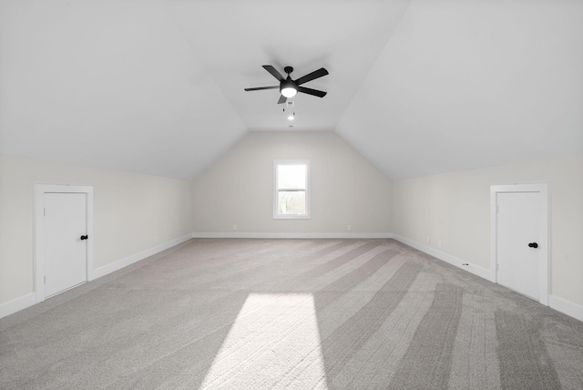 bonus room featuring light carpet, ceiling fan, and vaulted ceiling