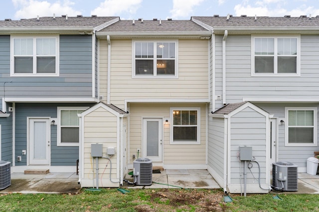 back of house with a patio area and central air condition unit