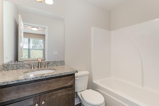 full bathroom with vanity, toilet, and washtub / shower combination