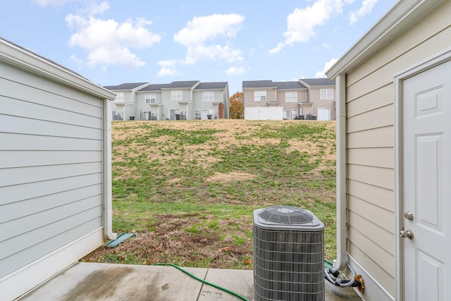 view of yard featuring central air condition unit