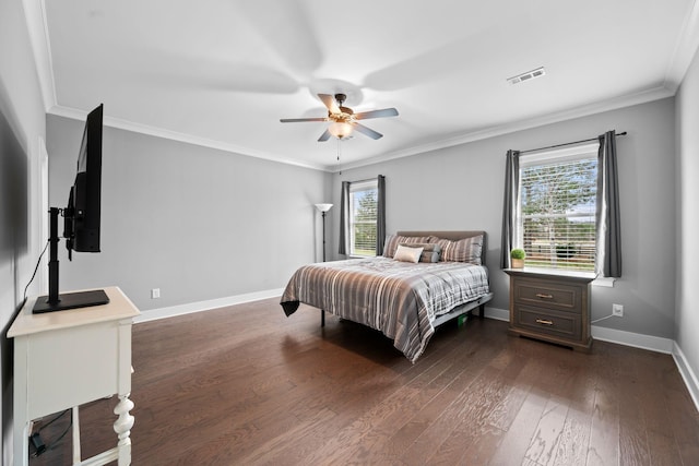 bedroom with ceiling fan, dark hardwood / wood-style flooring, and ornamental molding