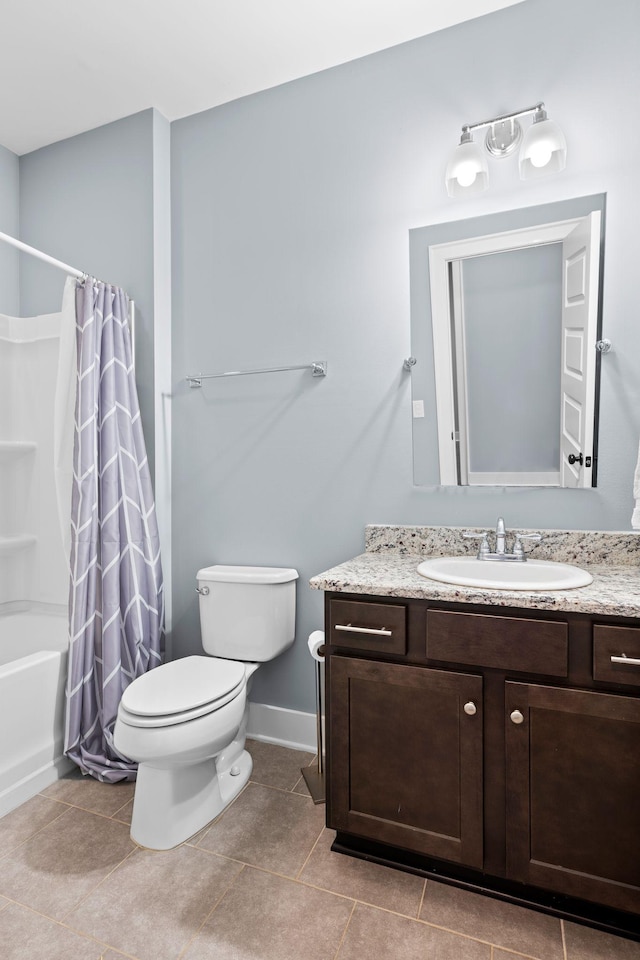 full bathroom with tile patterned floors, vanity, toilet, and shower / bath combo with shower curtain