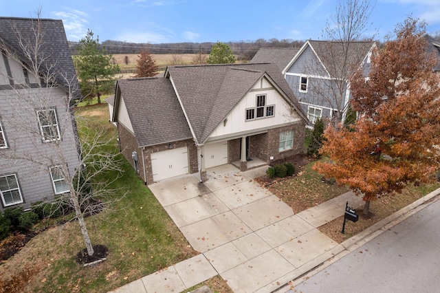 view of front of property featuring a front yard and a garage