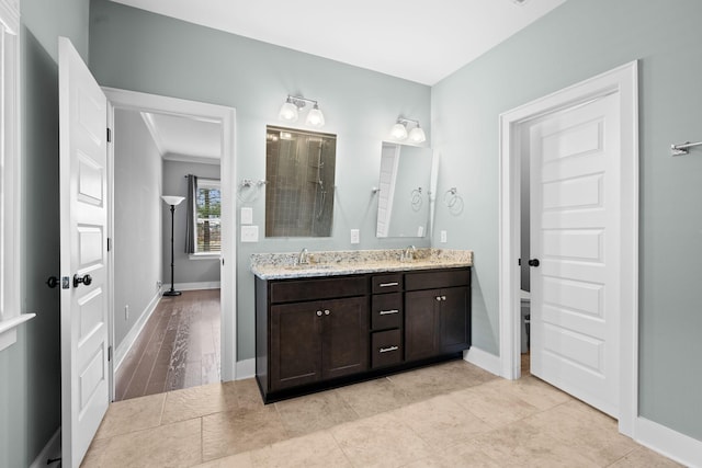 bathroom with wood-type flooring and vanity