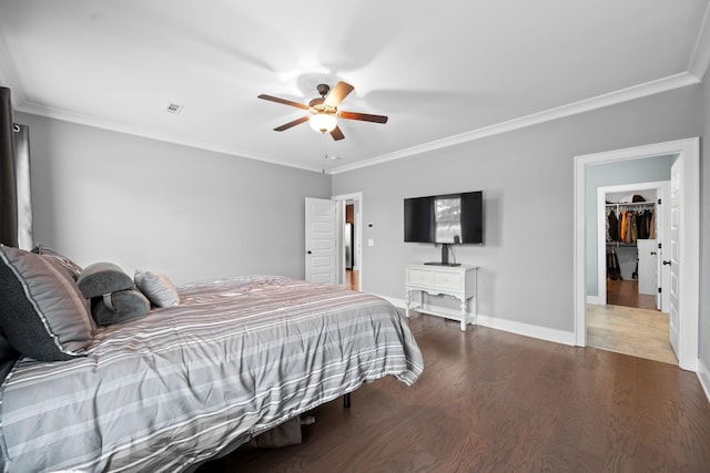 bedroom featuring hardwood / wood-style floors, ceiling fan, and crown molding