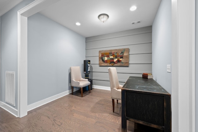 office space with wood-type flooring