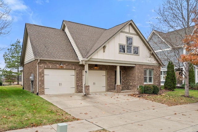 view of front facade featuring driveway, a shingled roof, a front lawn, and brick siding