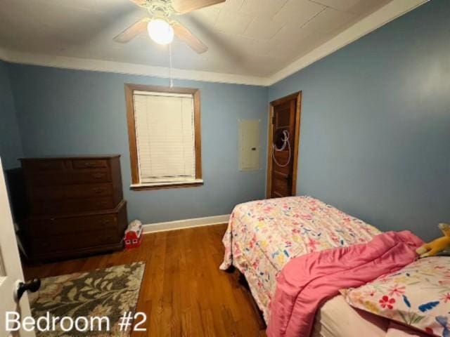 bedroom with ceiling fan and dark wood-type flooring