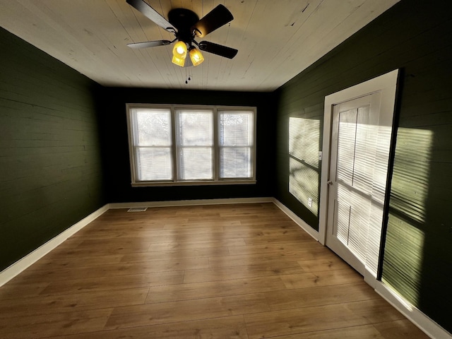 spare room with ceiling fan and light hardwood / wood-style floors