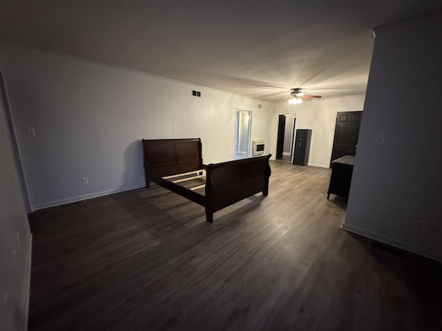 bedroom featuring ceiling fan and dark hardwood / wood-style flooring