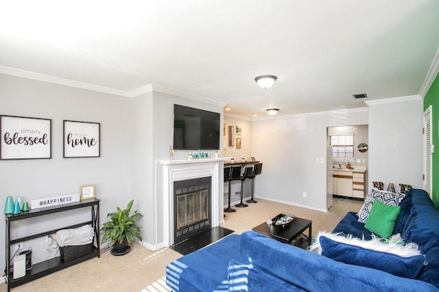 living room featuring crown molding and carpet