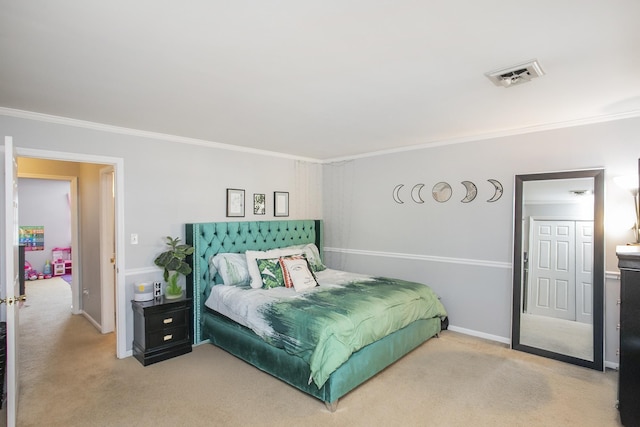 carpeted bedroom with ornamental molding