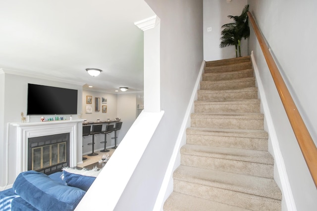 stairs with crown molding