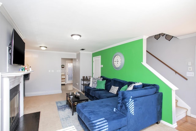 living room with carpet and crown molding