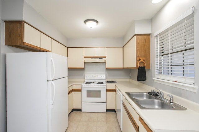 kitchen featuring sink and white appliances