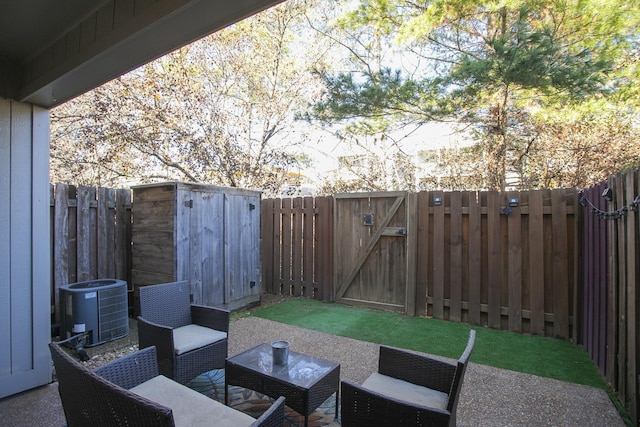 view of patio featuring central AC unit and a storage shed