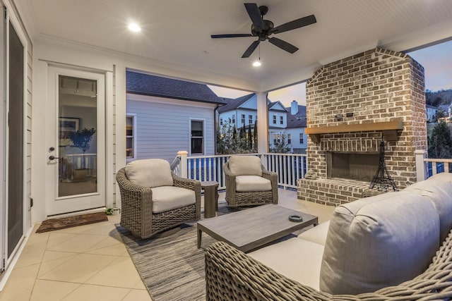 exterior space with an outdoor living space with a fireplace and ceiling fan