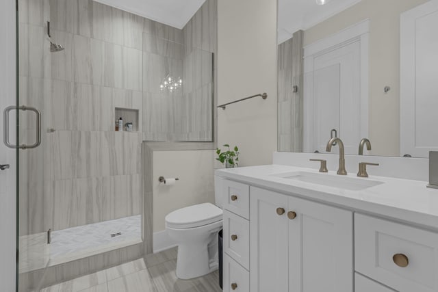 bathroom featuring tile patterned floors, vanity, toilet, and walk in shower