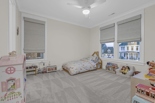 bedroom with multiple windows, light carpet, and ceiling fan