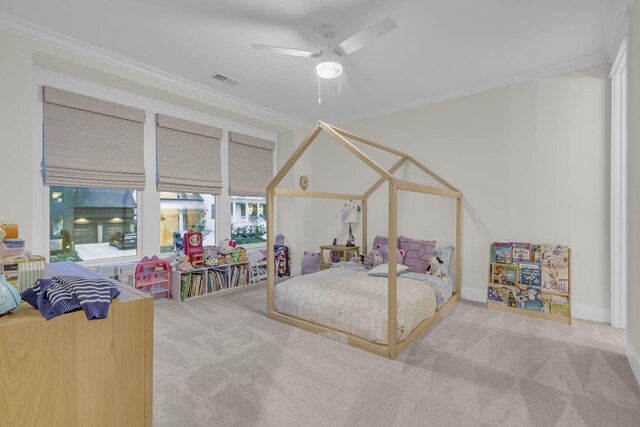 bedroom featuring carpet, ceiling fan, and crown molding