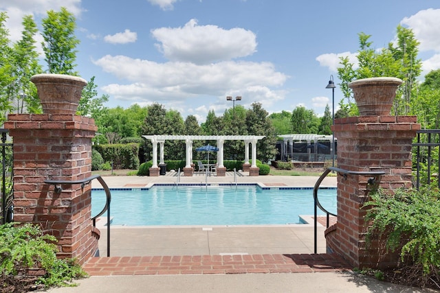 view of swimming pool featuring a pergola